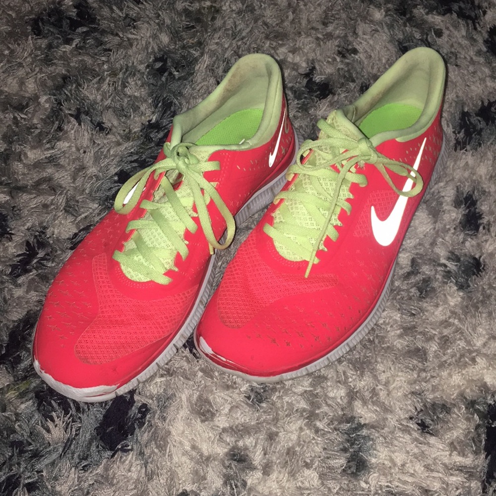 Orange and neon yellow Nike running shoes